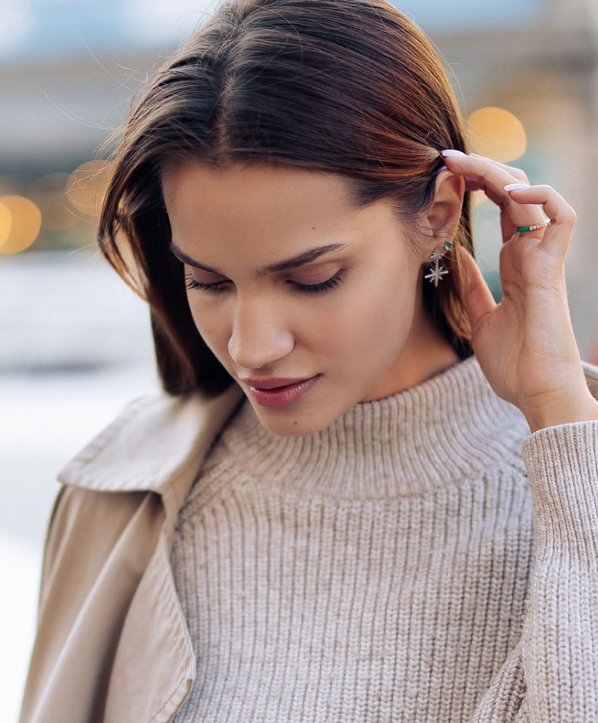 Woman with long hair wearing a cozy sweater.