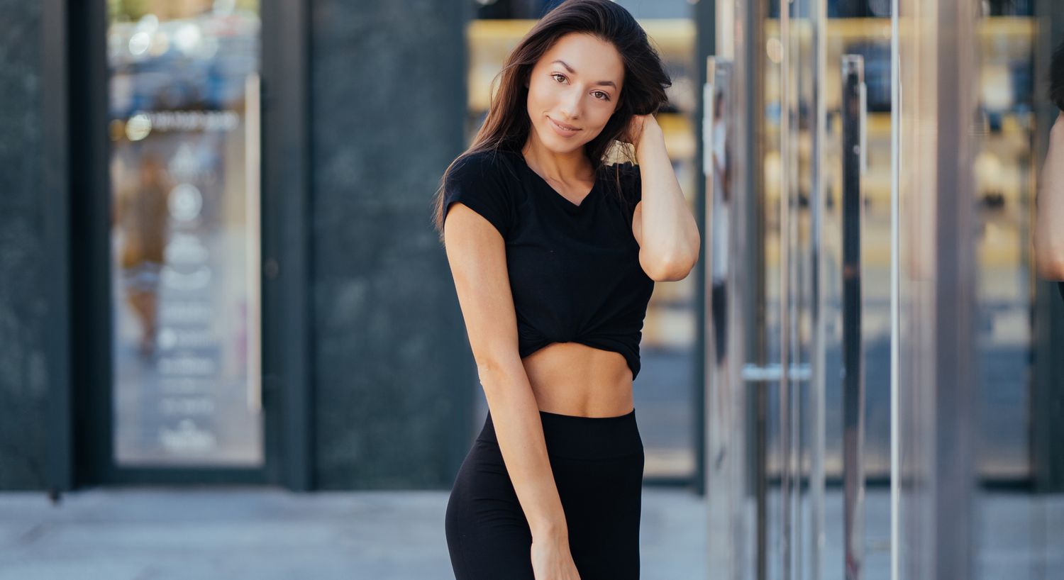 Young Denver EON model posing in stylish black outfit.